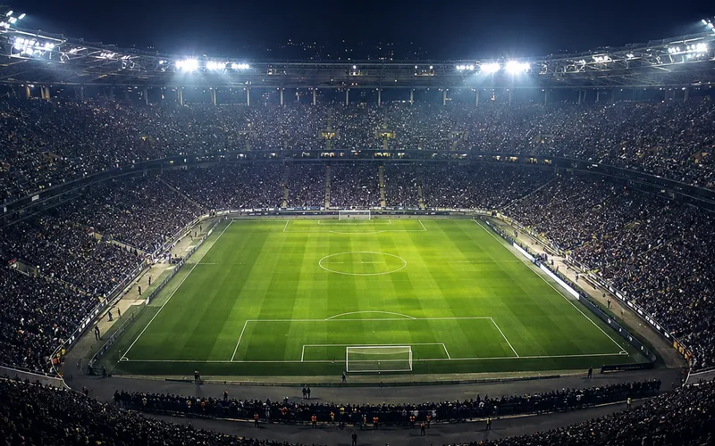 A floodlit stadium during an evening match